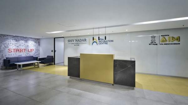 Delhi's skyline illuminated with startup symbols, showcasing a dynamic innovation hub with entrepreneurs collaborating.